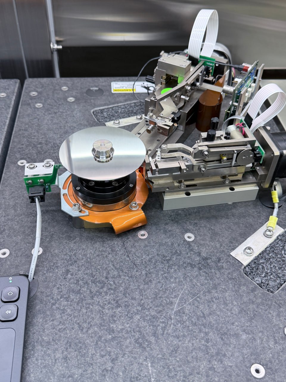 Hard drive platter cleaning on burnishing machine inside clean room — Seagate data recovery Five Star Data Recovery