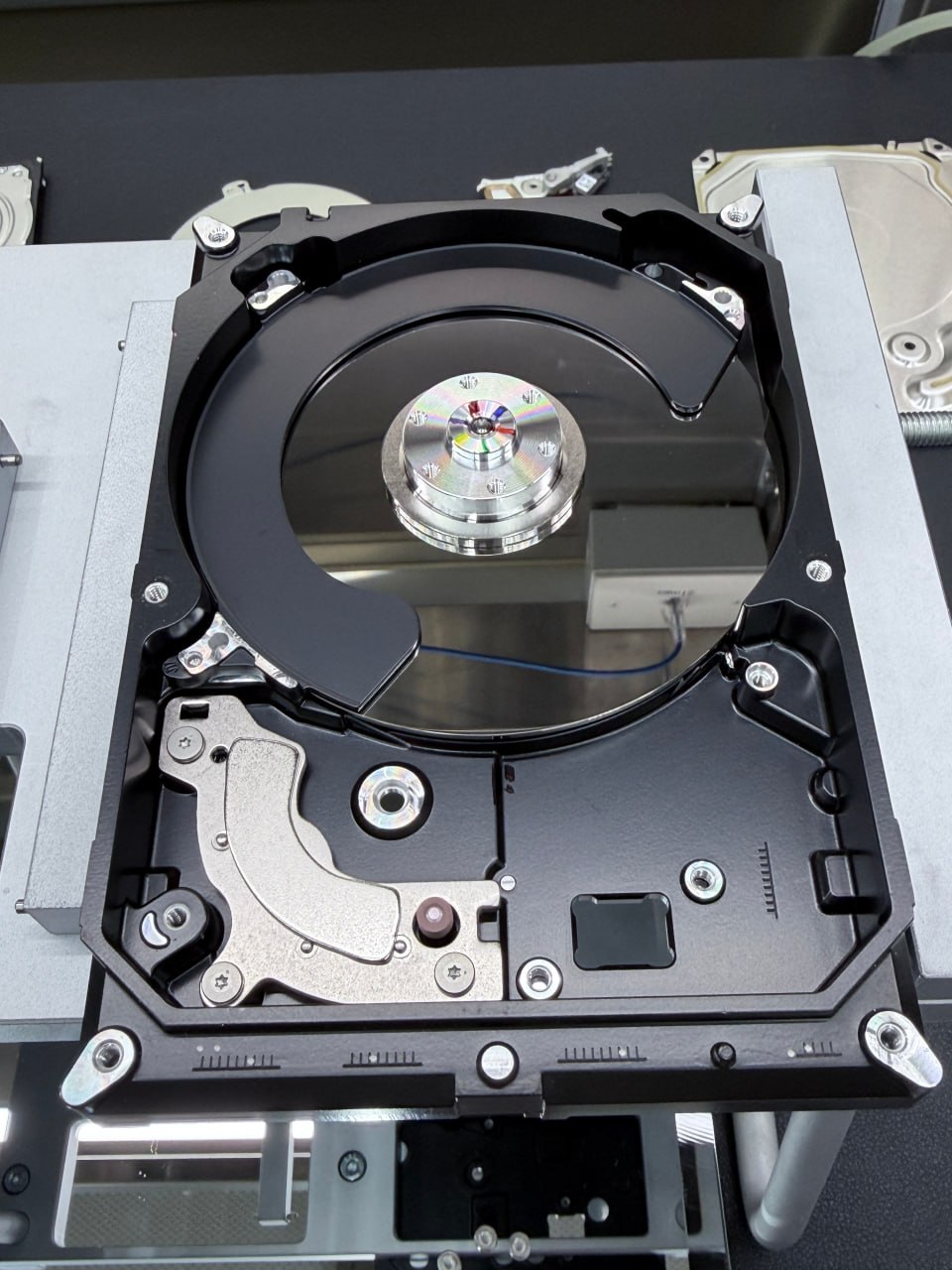 Hard drive opened and platters exposed at Five Star Data Recovery clean room workstation