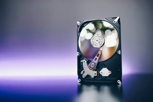 Open hard drive internal components — platters and read/write heads