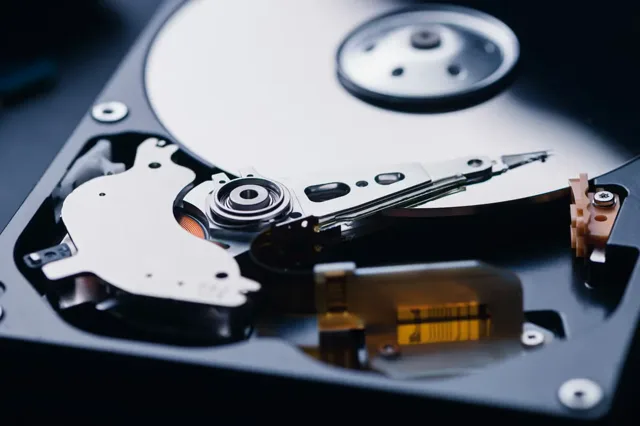 Inside a dropped hard drive — damaged platters and read/write head